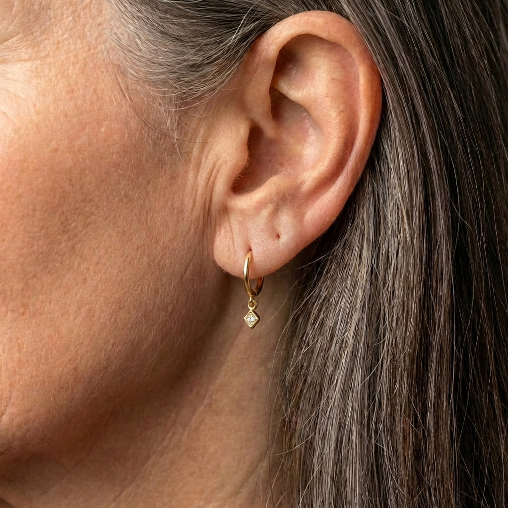 An Elegant Minimalist Gold Drop Huggie Earring Set