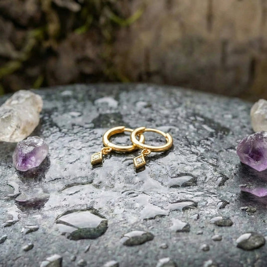 An Elegant Minimalist Gold Drop Huggie Earring Set