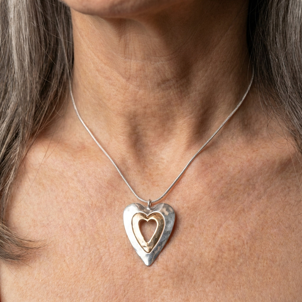 A Silver & Gold Heart Pendant Necklace