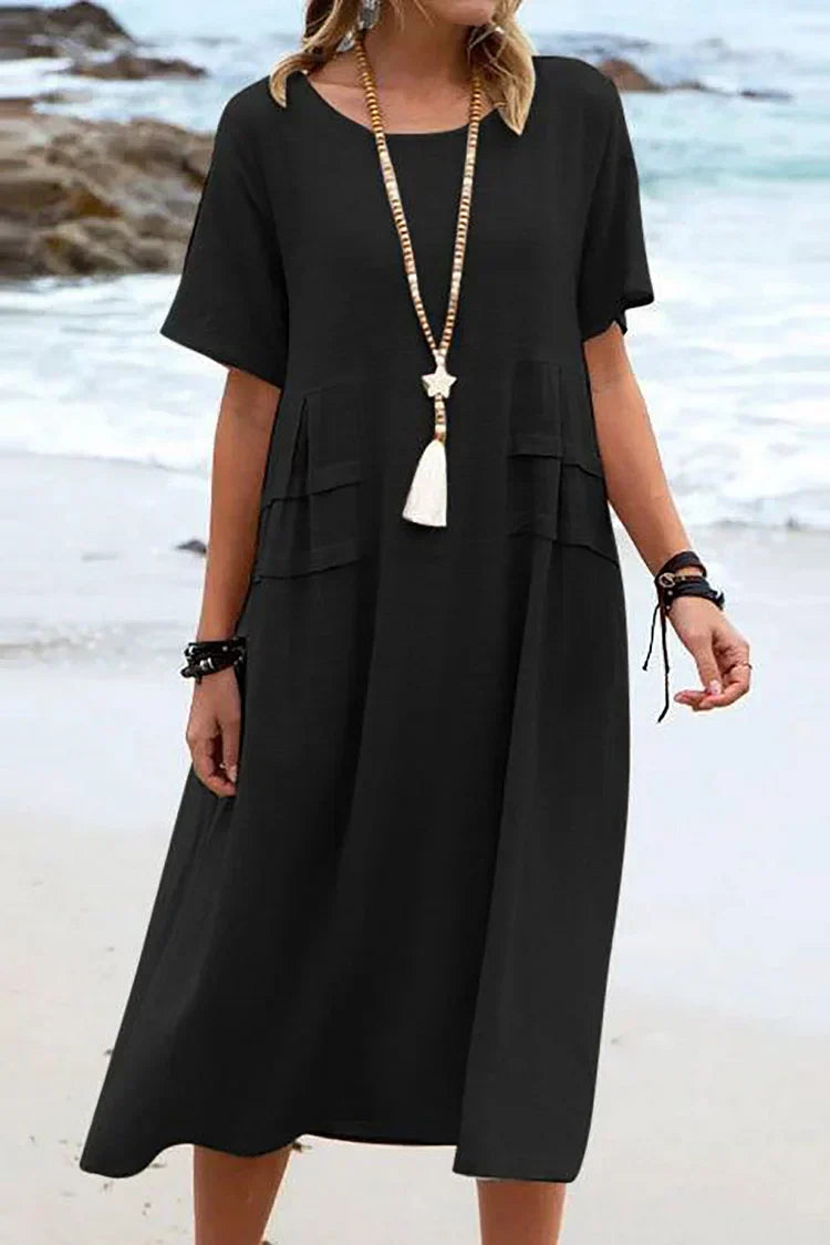 Loose, short-sleeved casual dress with a round neckline and plain colors